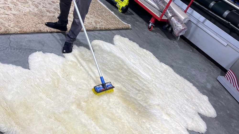 professional off-site rug cleaning facility used for Dr Carpet customer work with rugs collected from homes and prepared for cleaning